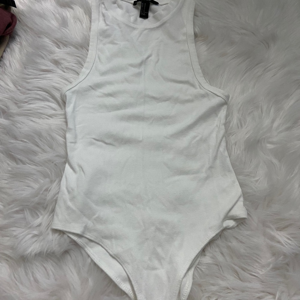 High neck white bodysuit.
